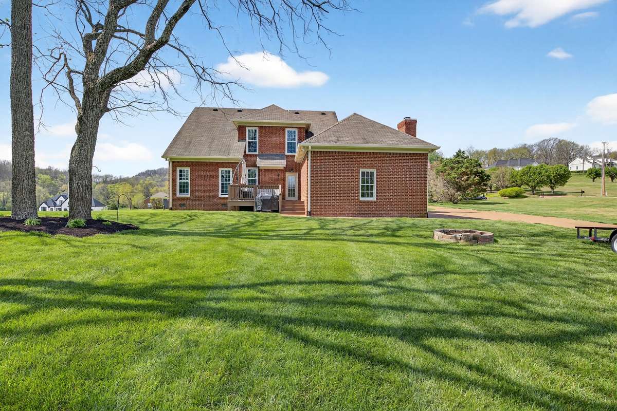 You will enjoy this beautiful backyard and firepit area.