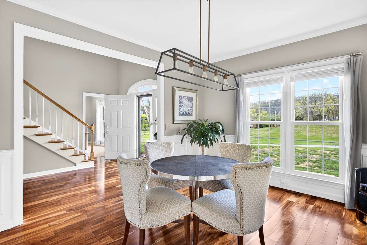 The space to the left of the foyer has been set up as a formal dining space.