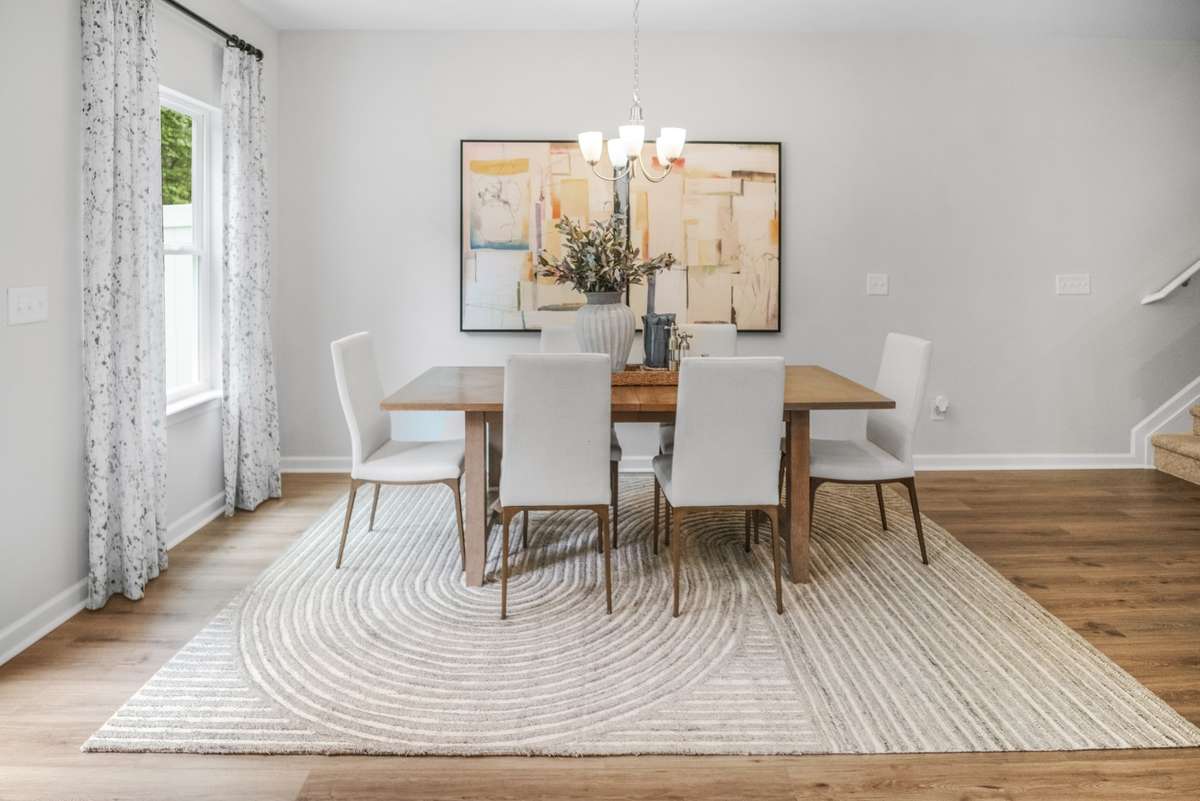 This picture is from our furnished and decorated model home in the community.  Window placement and color scheme may vary per unit location.  Ask agent for more specific details regarding colors and options.  Dining will feature extra windows.