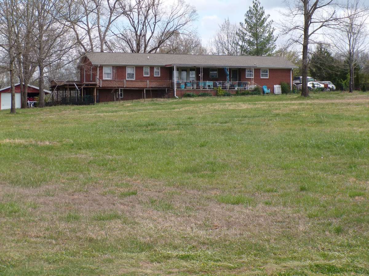 Back of property with covered patio