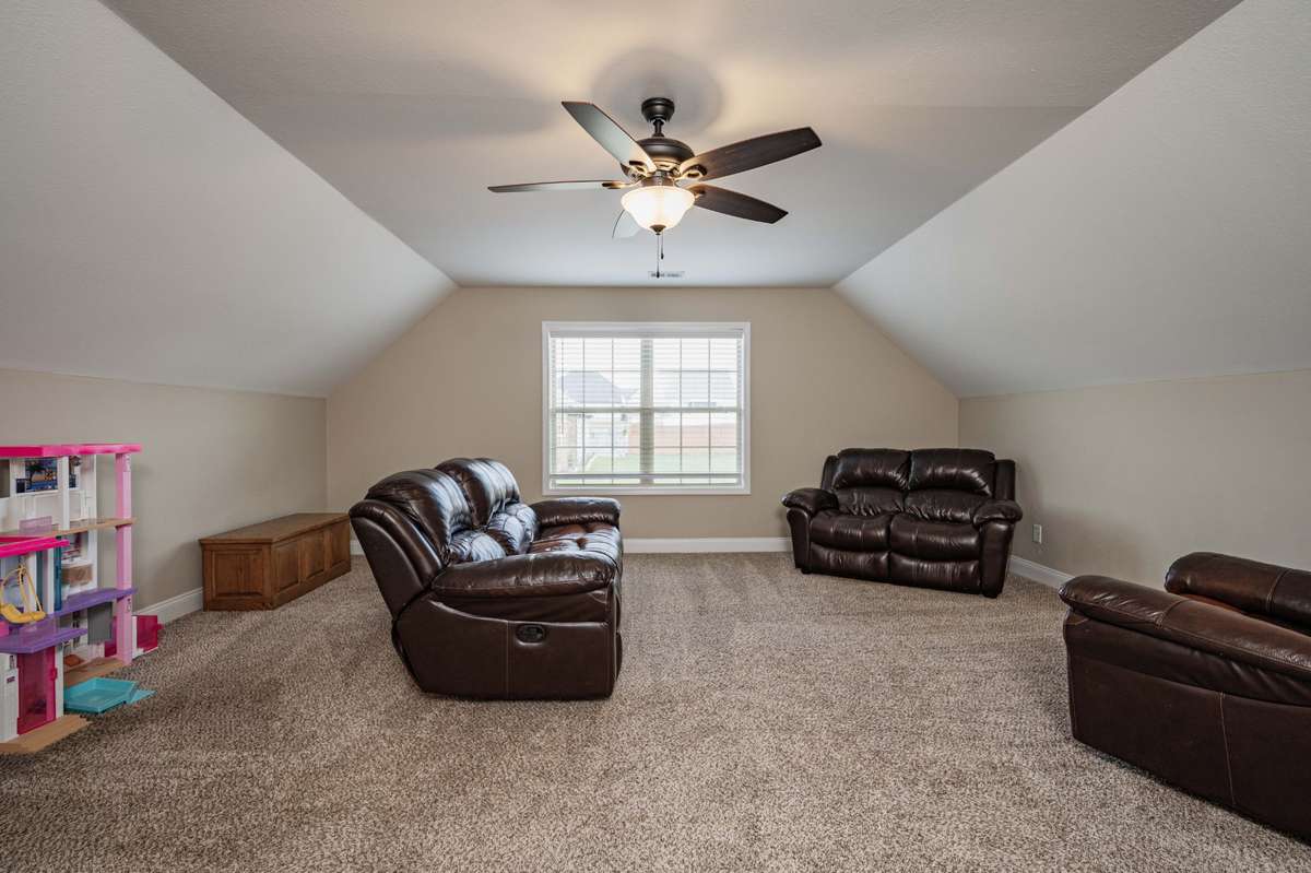 Create a comfortable setup for movie nights or game day viewing. Upstairs over garage.