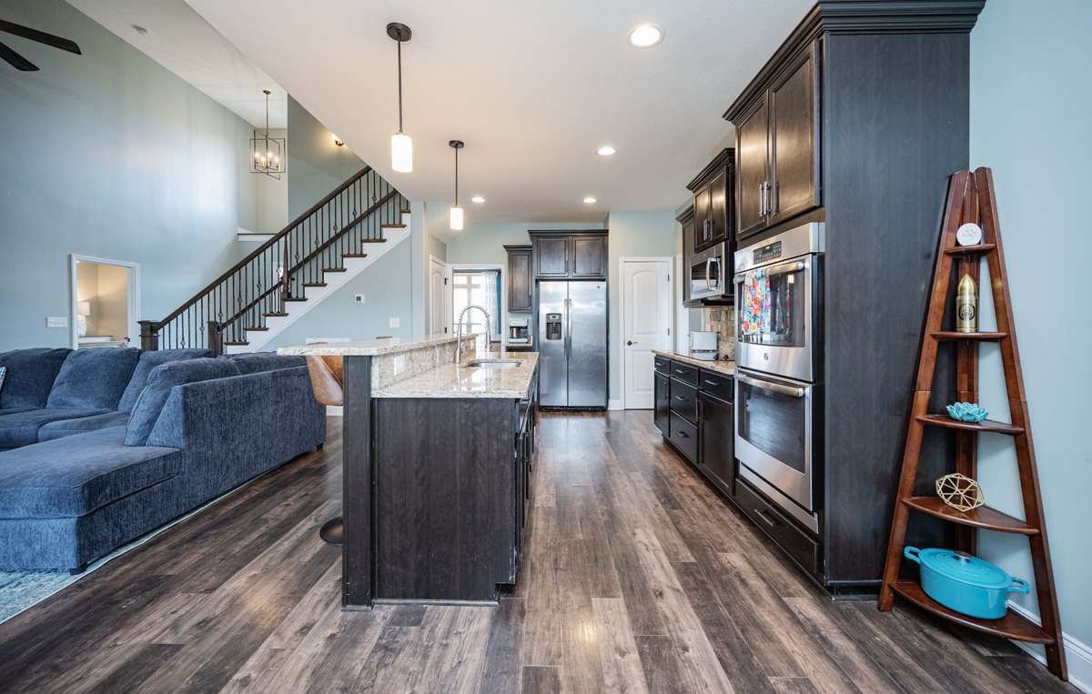 From this angle you can see how much counter space runs along the perimeter with room to prep and serve without crowding the island workspace.