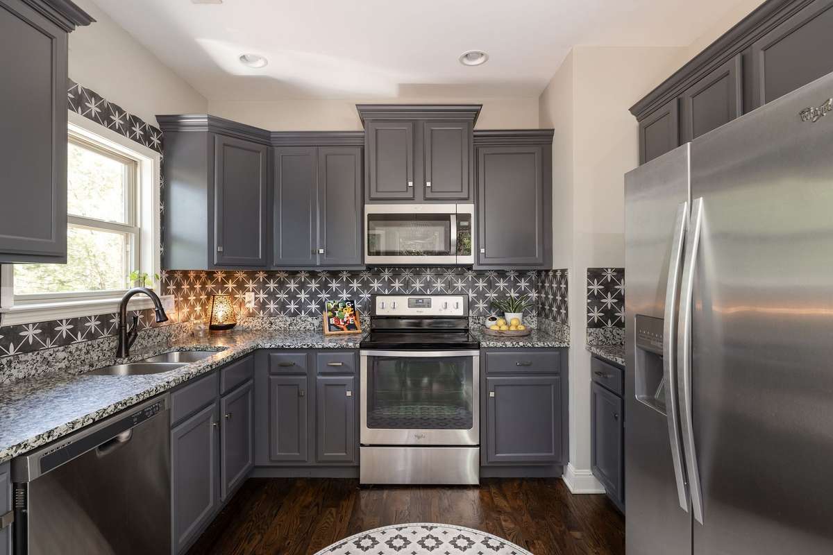 Kitchen sink window facing your oasis and lots of storage in the wonderfully updated kitchen.