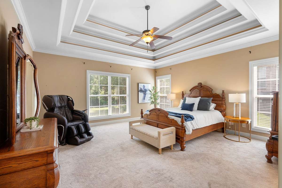 Primary bedroom, 3 tiered trey ceiling and so much natural light!