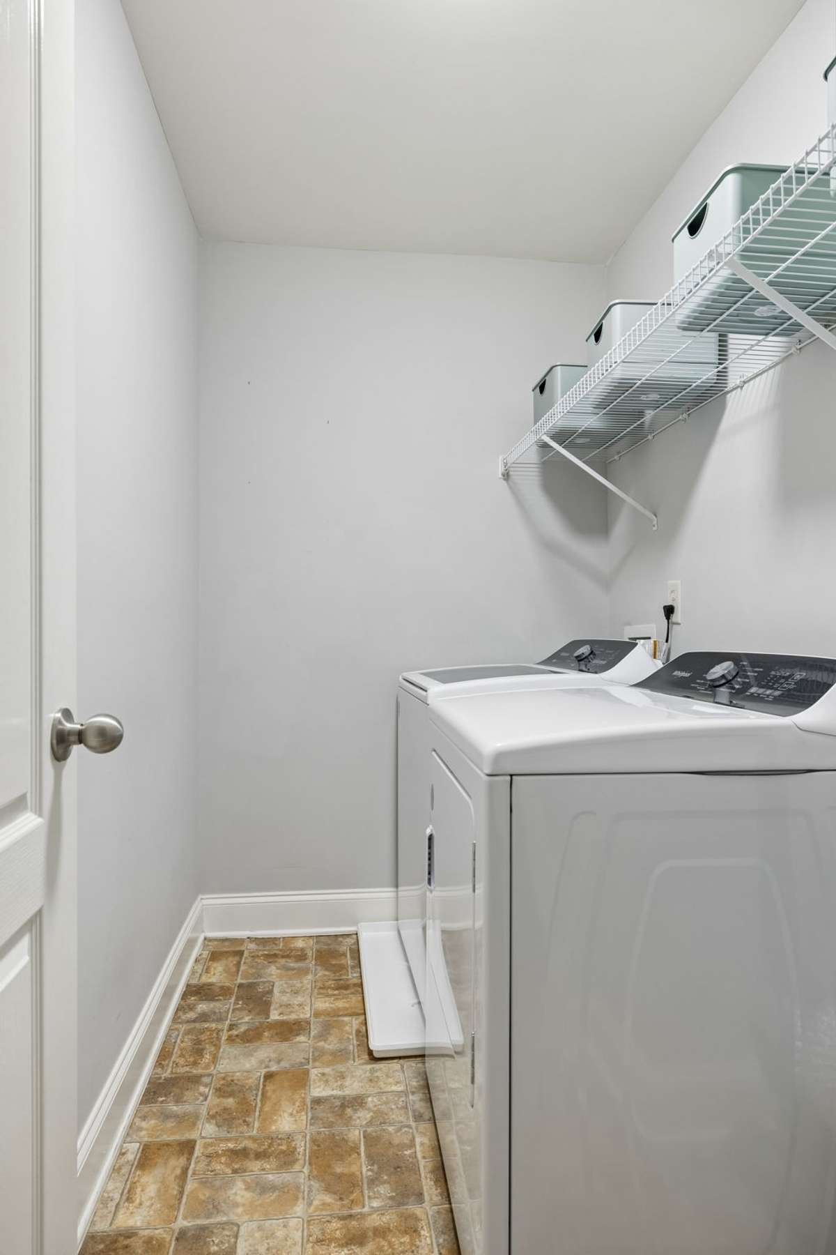 The upstairs laundry room is such a nice convenient and the newer washer and dryer remain.