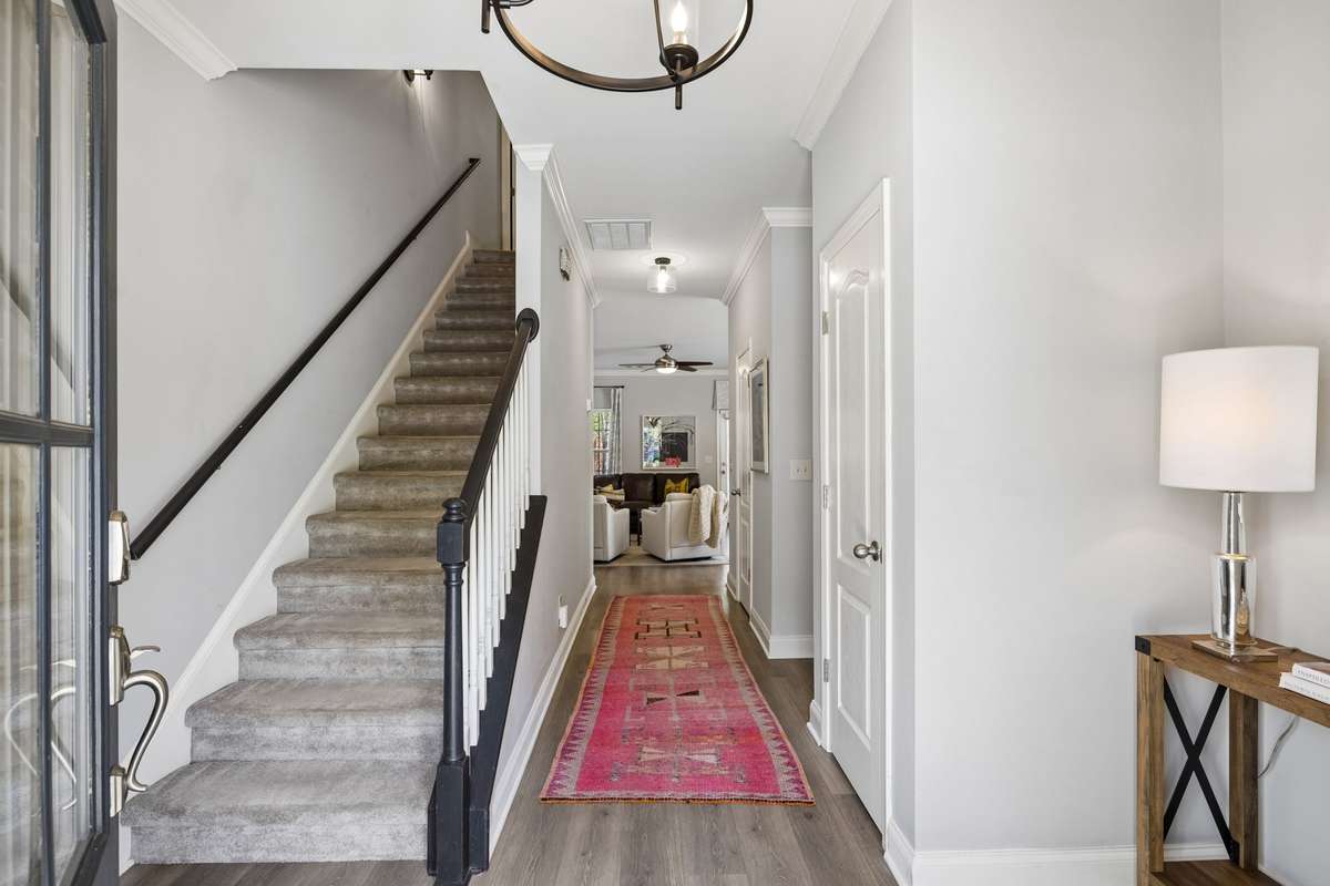A bright and cheerful entry greets you as you step inside,