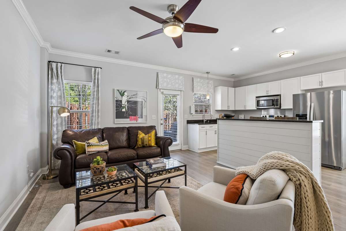 This magazine worthy space offers plenty of room for gathering, entertaining, or enjoying relaxing days at home.  The spacious living room opens seamlessly to a well appointed ktichen and dining area beyond.