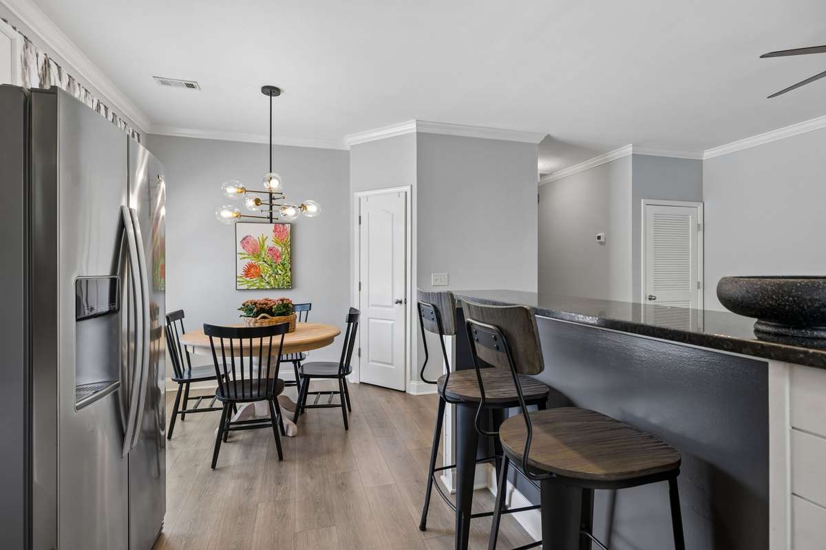 This center island area offers additional seating and extra counter space for serving or meal prep.