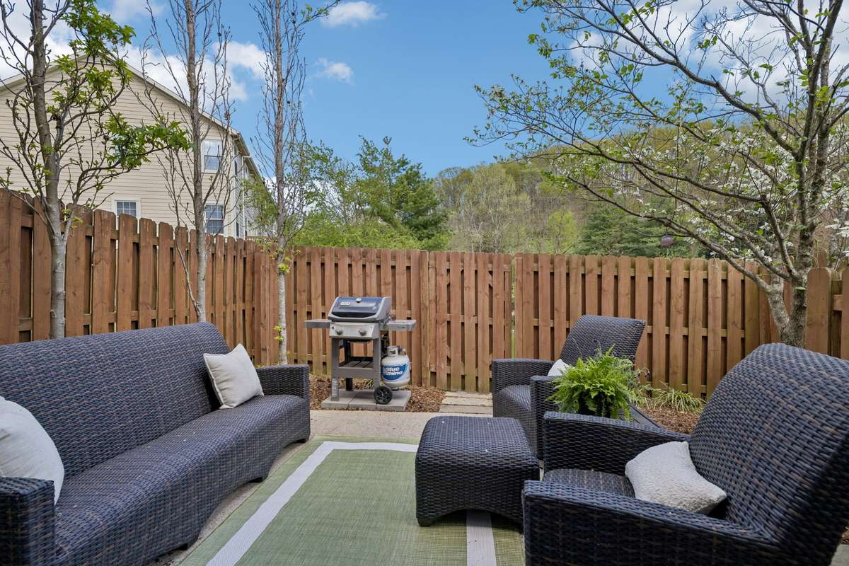 What a wonderful space to enjoy a morning coffee or evening barbecue!   The fully fenced back area adds privacy and the landscaping and outdoor lighting enhances this area.