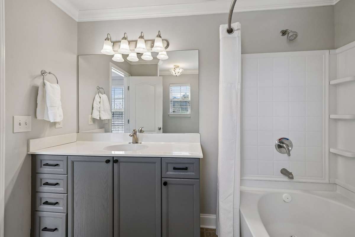 The stylish grey cabinetry offers quite a lot of storage.