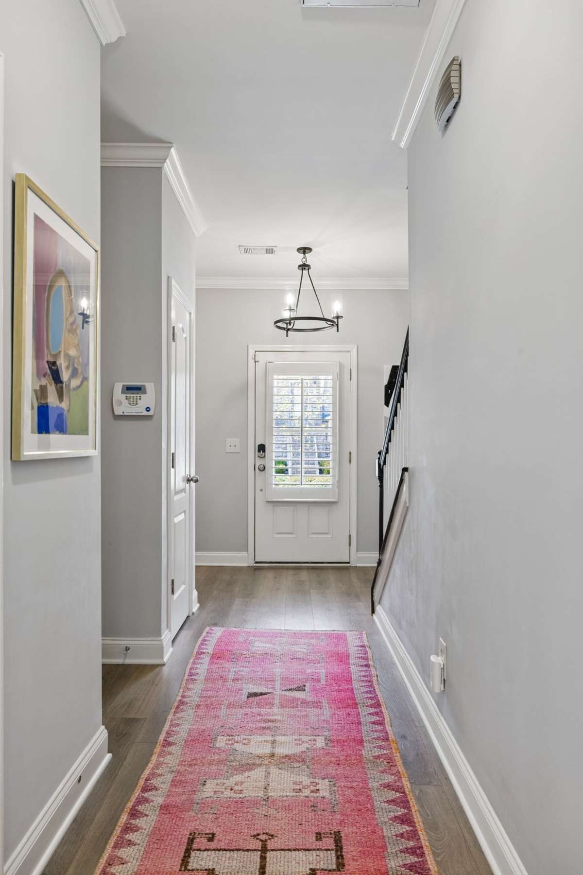 A look back at the front door which has plantation shutters, offering both style and privacy.