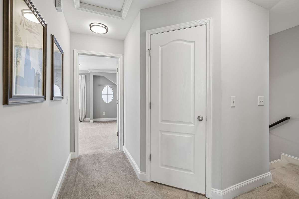 The door in front of you leads to a walk in linen closet - the storage space in this townhouse is terrific!