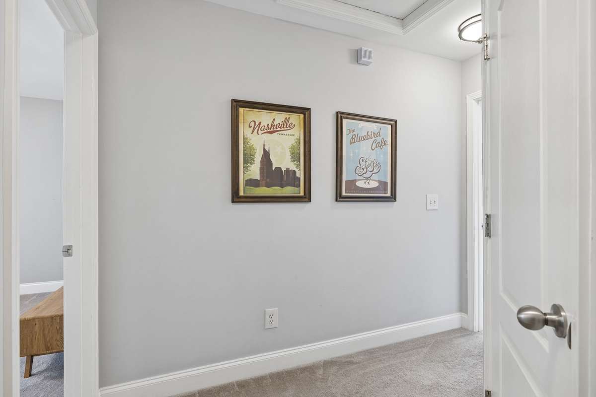 The upper level hallway is bright and spacious, and the carpet throughout the upstairs is in wonderful condition.