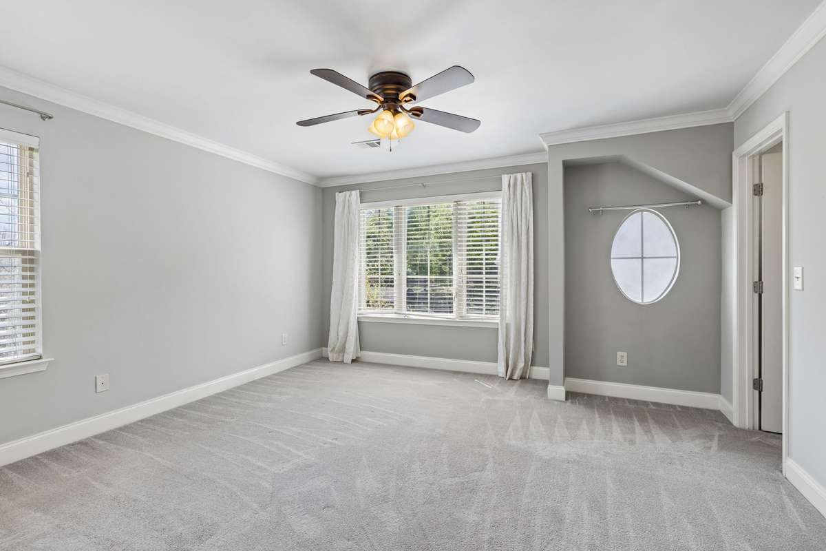 The primary suite has plenty of room for a desk or reading nook.