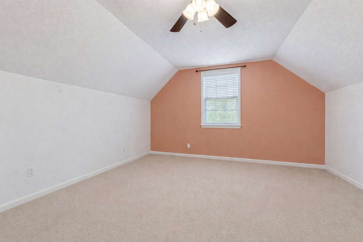Upstairs bedroom 2. Photo digitally altered to remove furniture.
