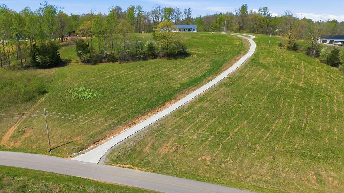 Thousands in Infrastructure like LONG CONCRETE DRIVEWAY, City Water run to the Home  
Natural Gas is at the Neighbors. NOTE: Green Grass Edits on Exterior Photos