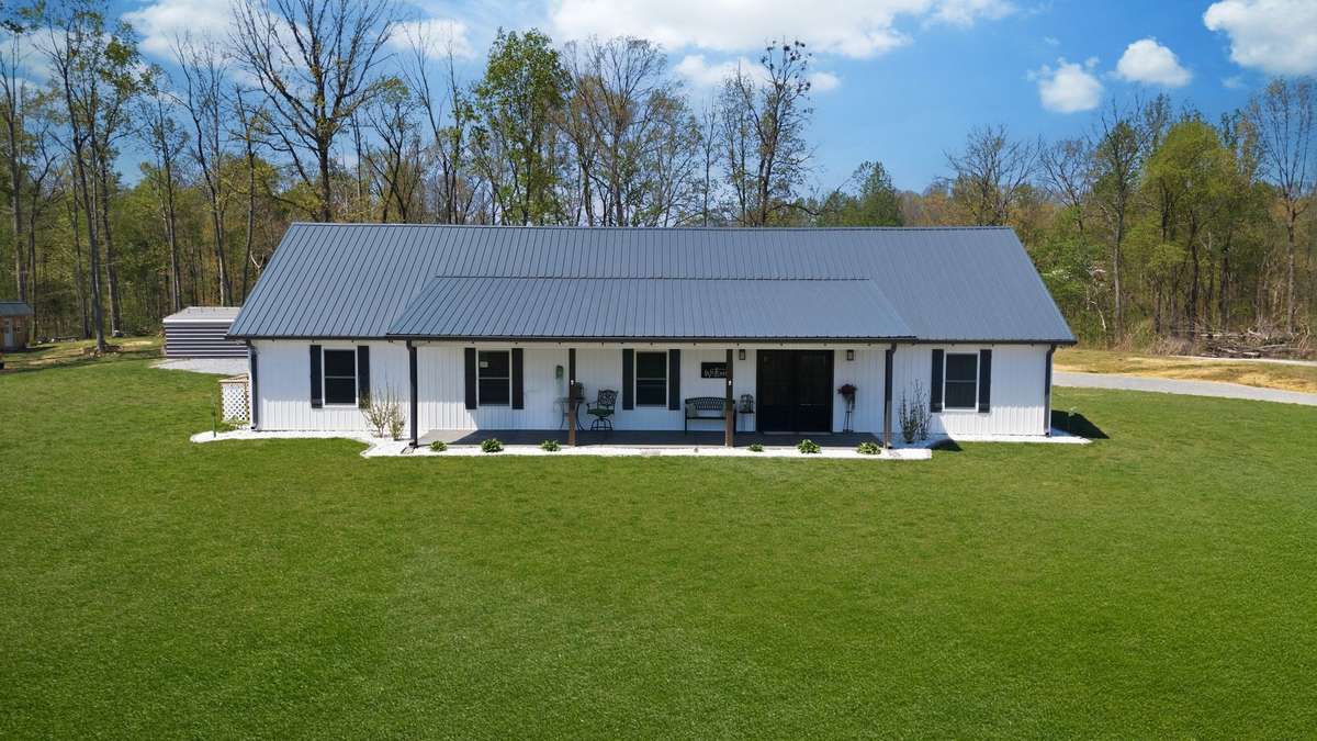 UPGRADED Metal Roof
NOTE: Green Grass Edits on Exterior Photos