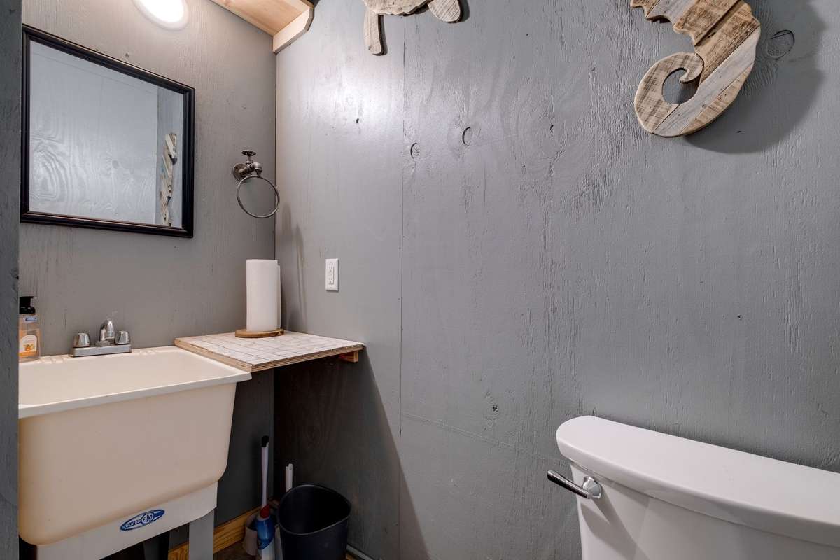 Utility Bathroom in the Garage. 
Bathroom drain is connected to septic drain but water not connected to Shower per Seller