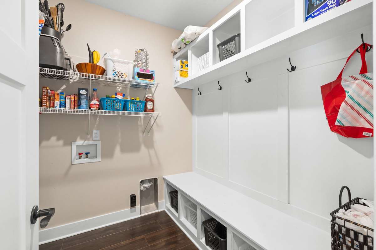 Drop Zone Closet down currently serving as a pantry. Has an alternate washer/dryer hook-up.