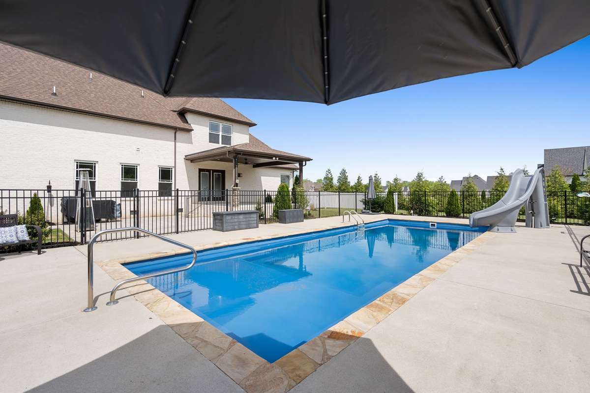 In-ground Salt Water pool with sun ledge and slide