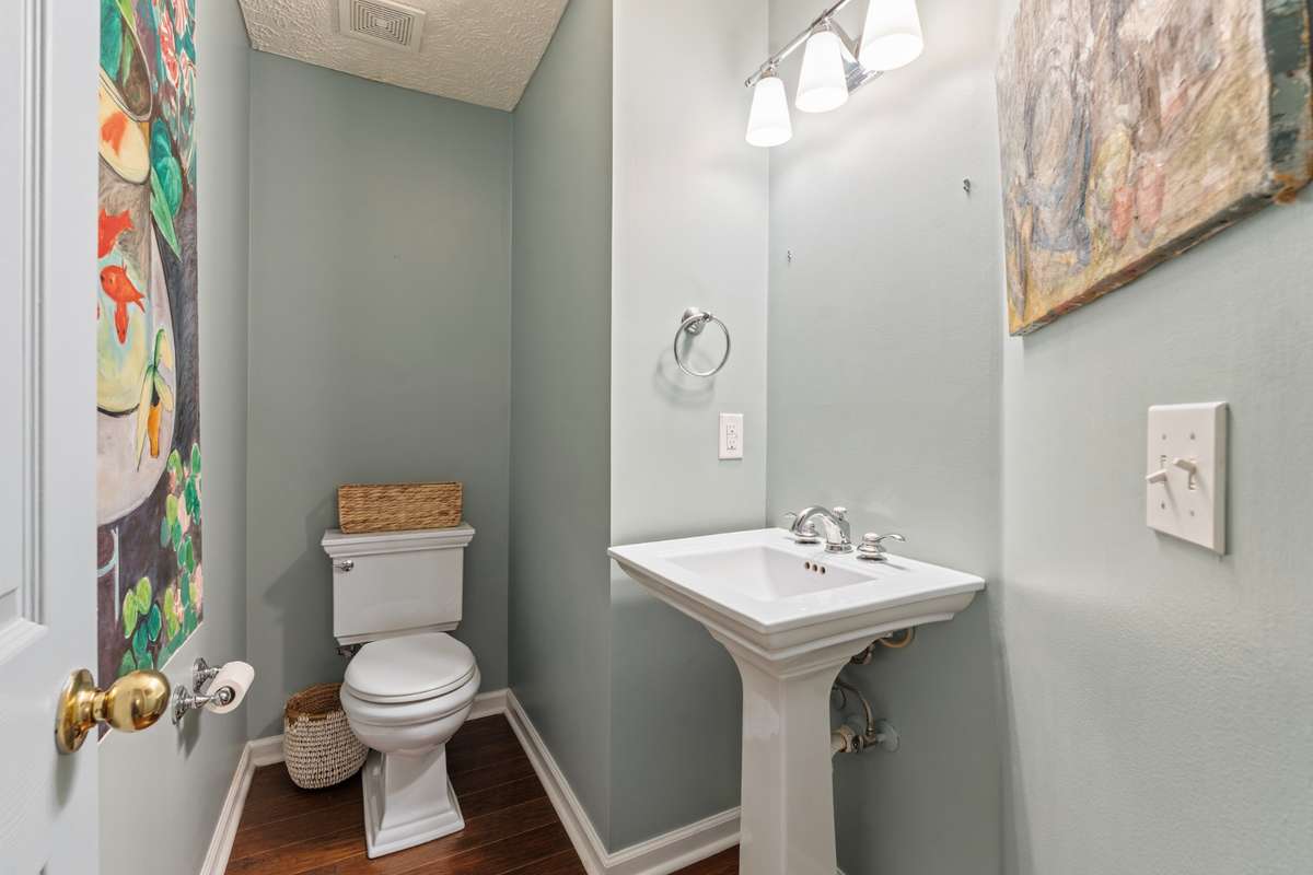 New pedestal sink, toilet and plumbing fixtures in the half bath