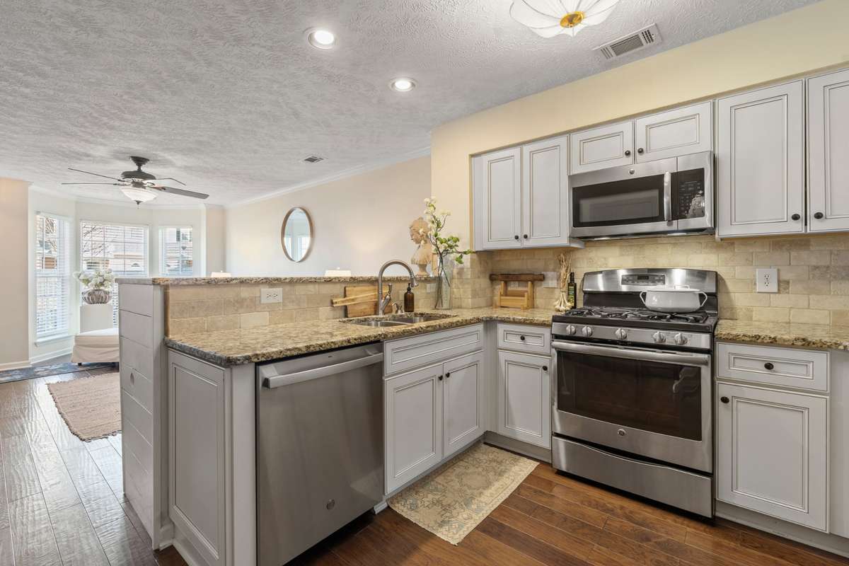 New cabinets, backsplash, granite countertops and stainless appliances (with gas range)