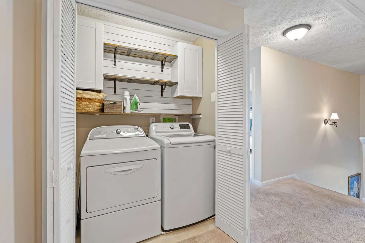 Two large suites surround a thoughtful laundry space + office/study nook...