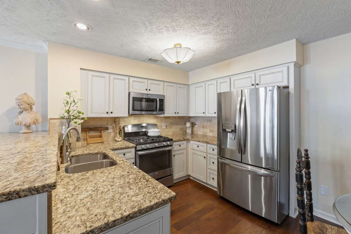 New cabinets, backsplash, granite countertops and stainless appliances (with gas range)
