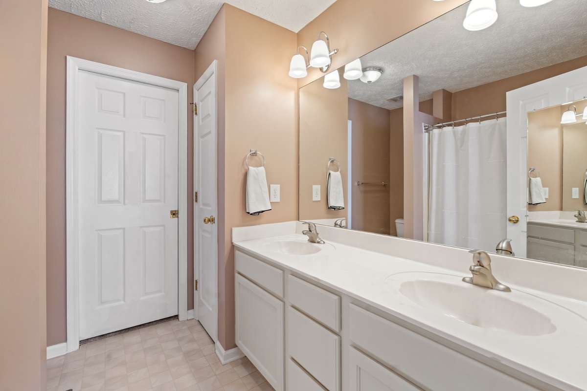 Primary Bath with Double Vanities + Walk-in/Linen Closets