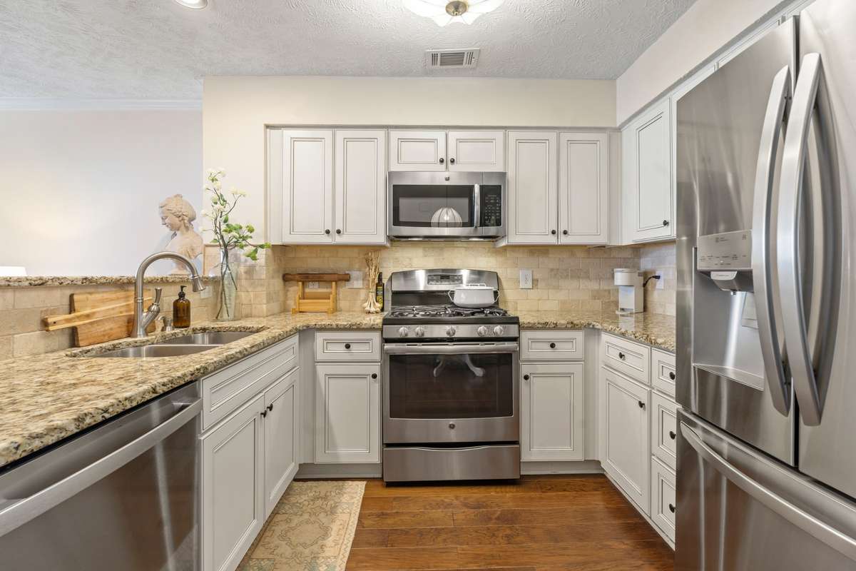 New cabinets, backsplash, granite countertops and stainless appliances (with gas range)