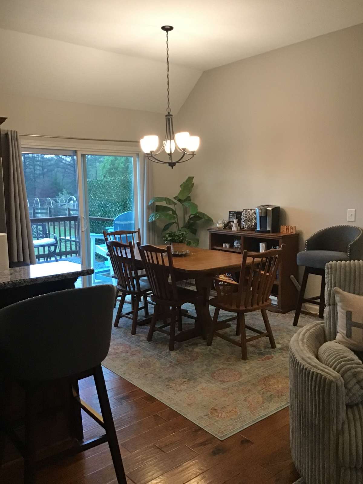 Dining area with sliding glass door to access deck and backyard