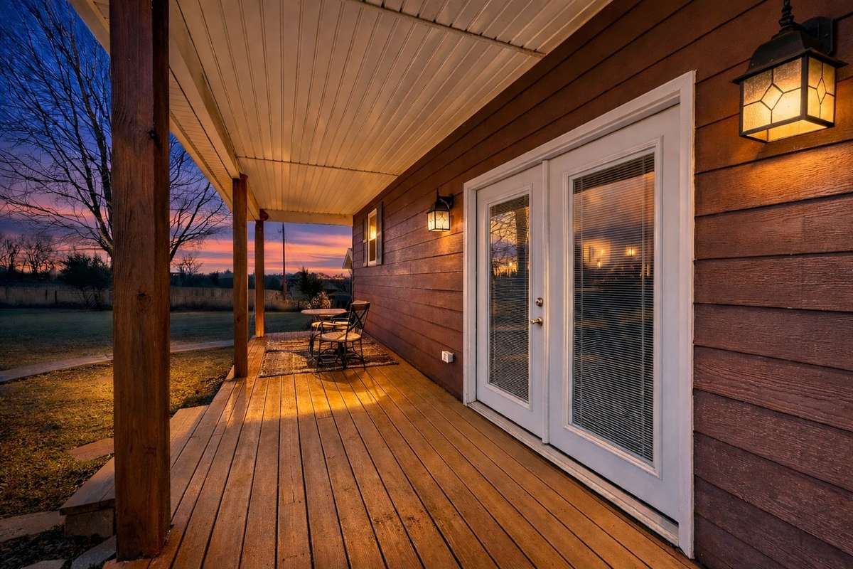 Relaxing back porch ideal for unwinding and enjoying the peaceful setting.