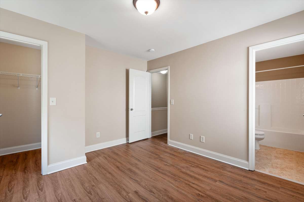 Spacious bedroom with walk-in closet and private en-suite bath for added comfort 