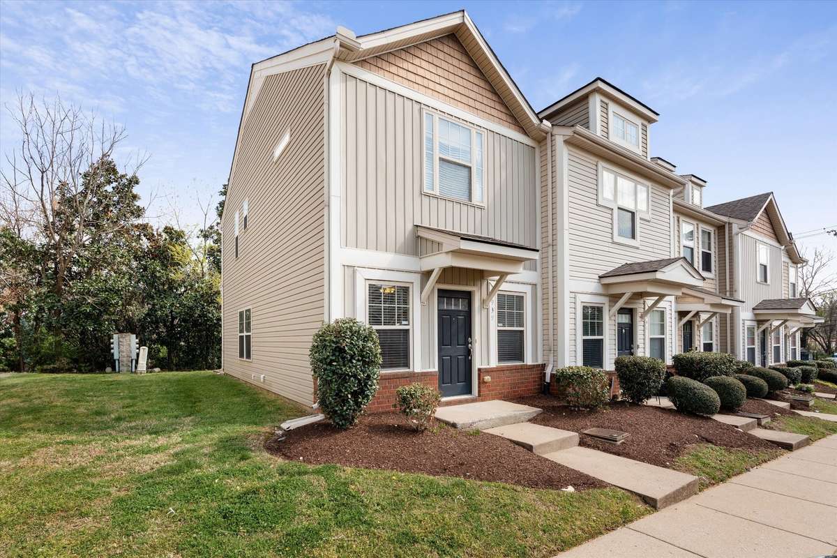 Charming exterior with partial brick, board & batten accents, and cedar-style siding for added character ✨