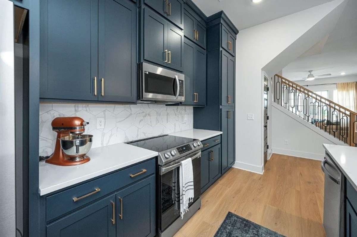 Pictures are of finished model at another community. Final finishes to vary.
