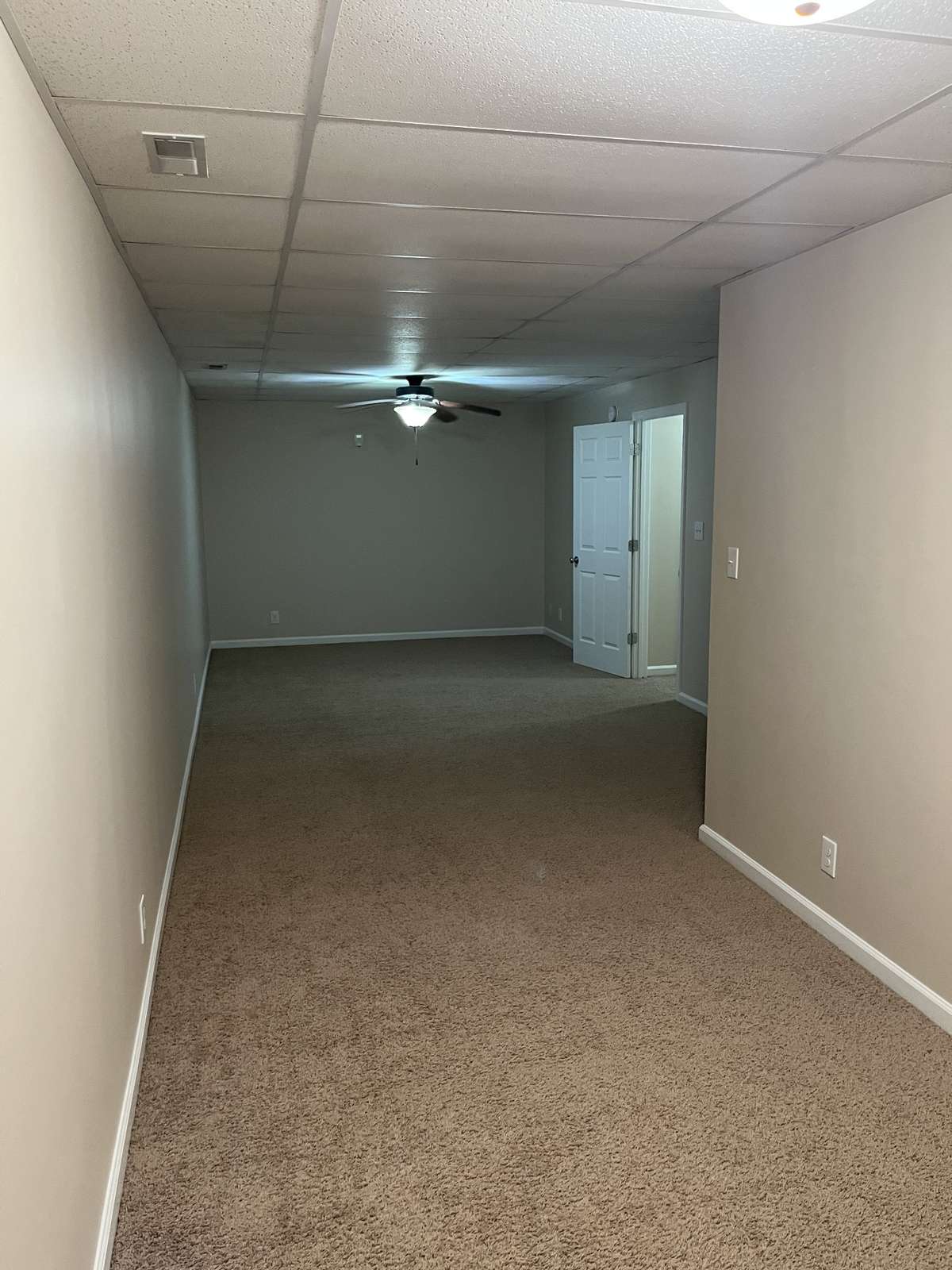 2nd room downstairs (33 feet deep. Wider section is 11' feet wide. Narrower section is 7' wide.)
