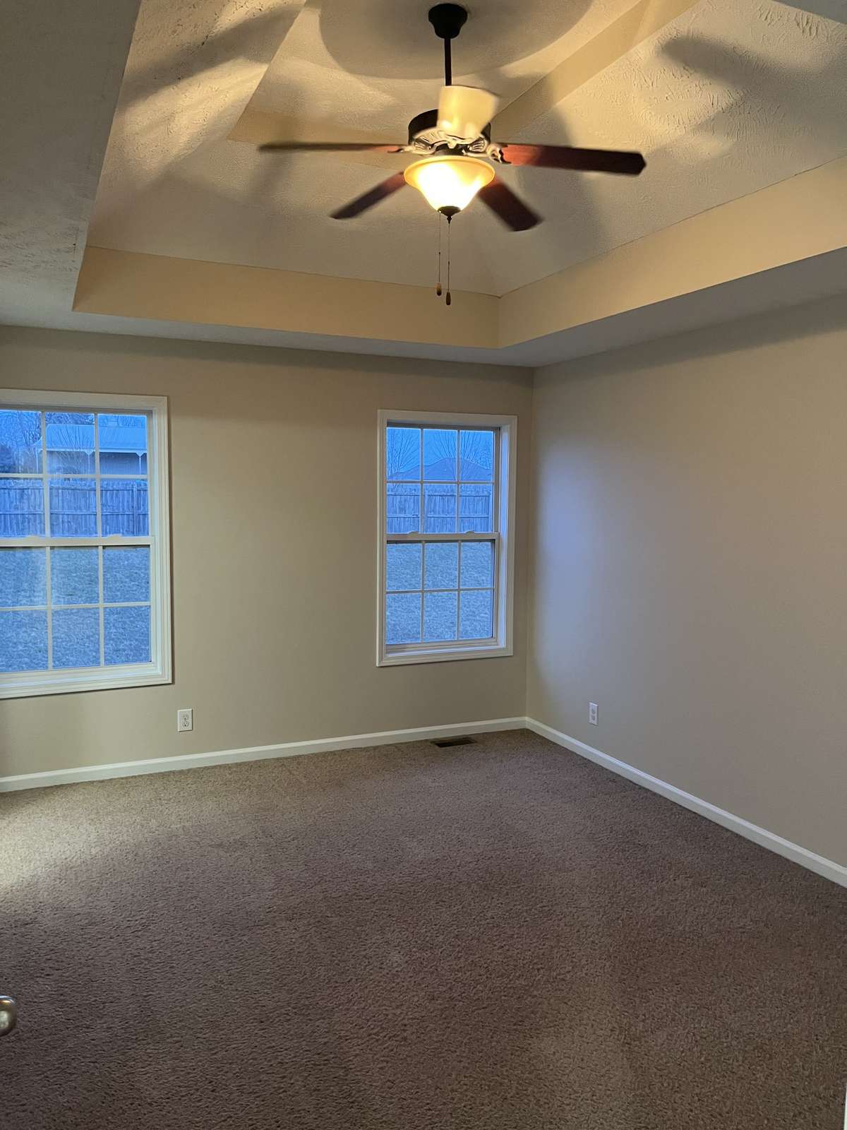Primary Bedroom with vaulted ceiling and ceiling fan