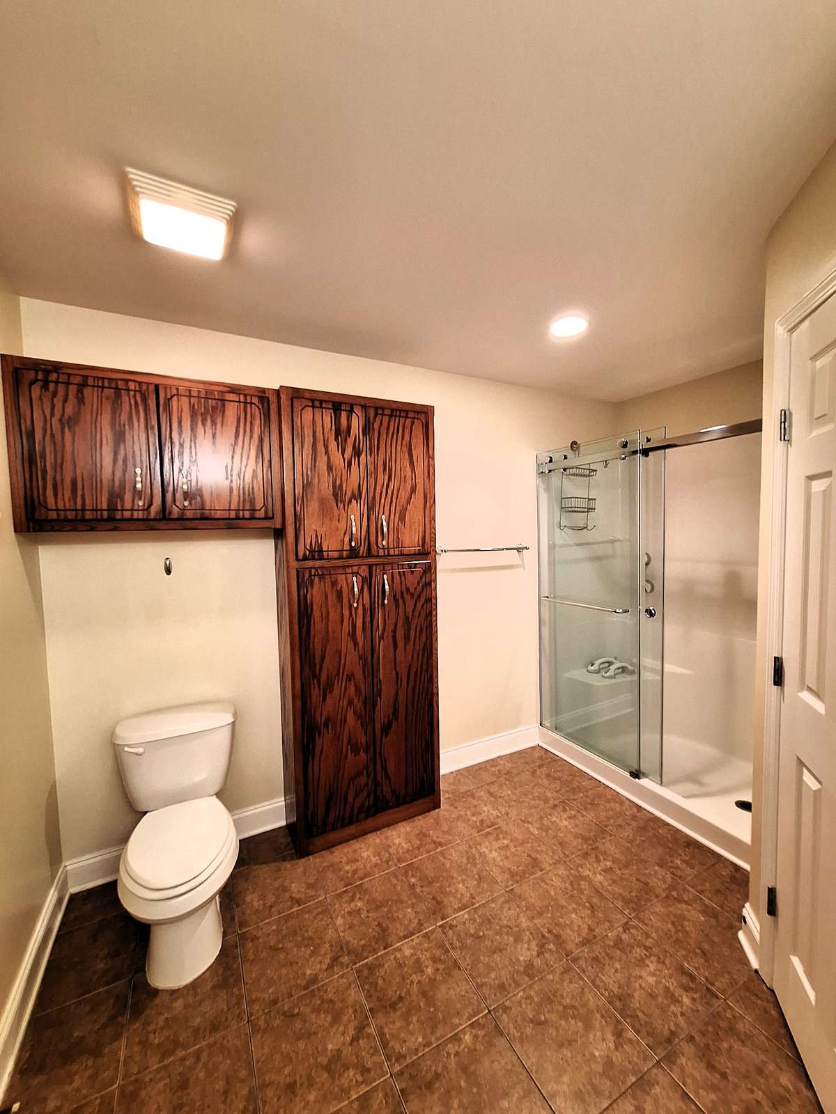 Handicap walk-in shower and more cabinets!! This house has matching parts all over the home!!