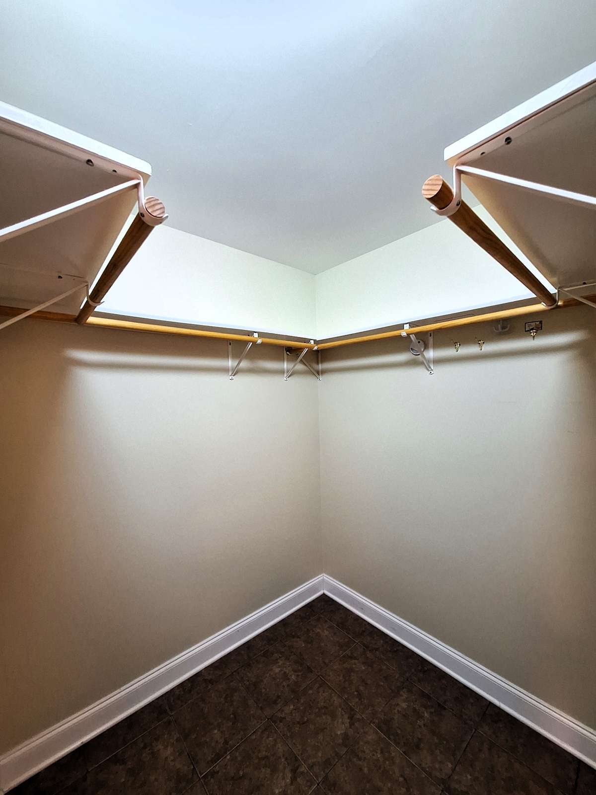 With a reconfiguration and an addition, this master closet could double in storage space for your clothes!