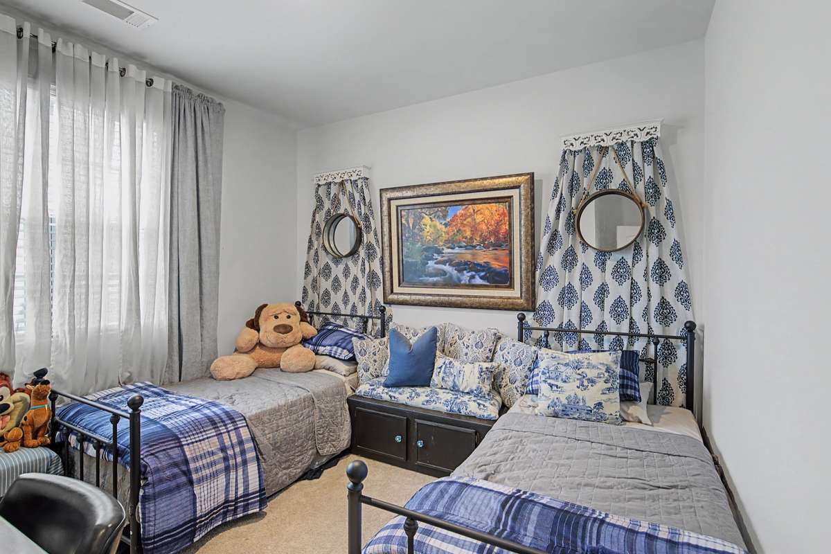 Bedroom 2: Comfortable secondary bedroom with versatile space for guests or a growing family