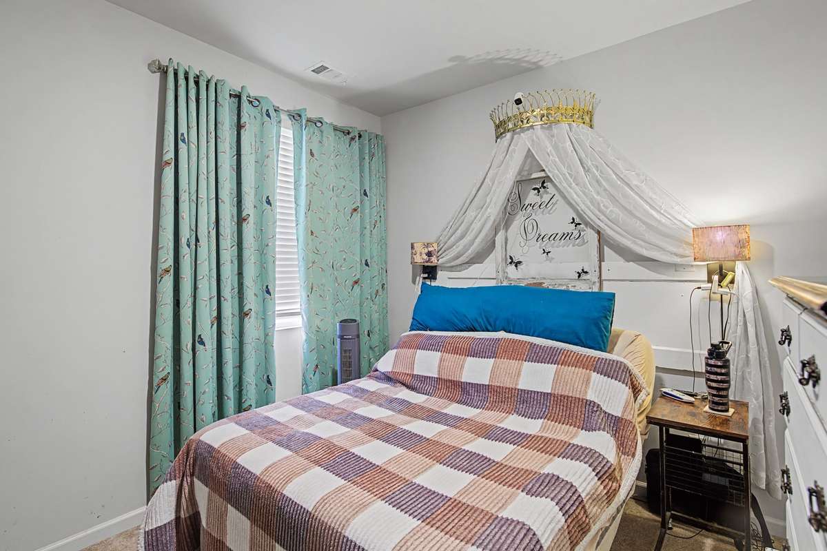 Bedroom 3: Bright and airy third bedroom featuring neutral tones