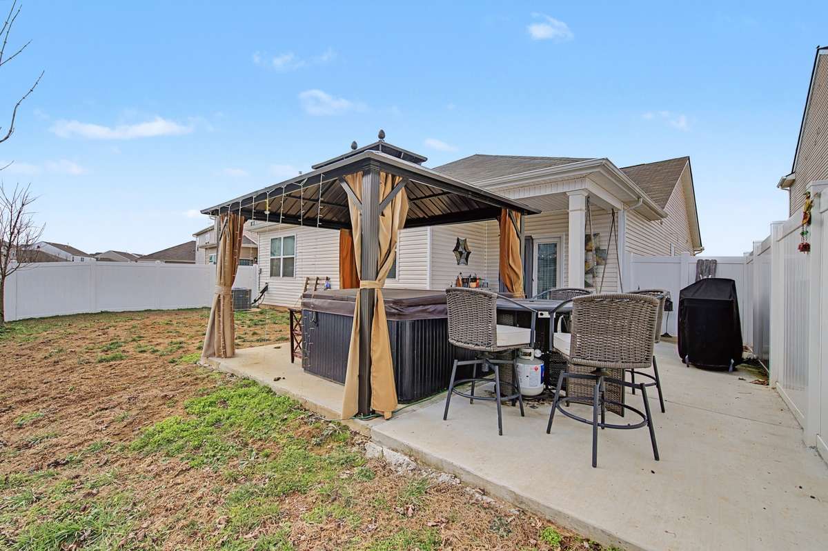 Outdoor Gazebo: Custom backyard gazebo and extended concrete patio, perfect for hosting summer gatherings