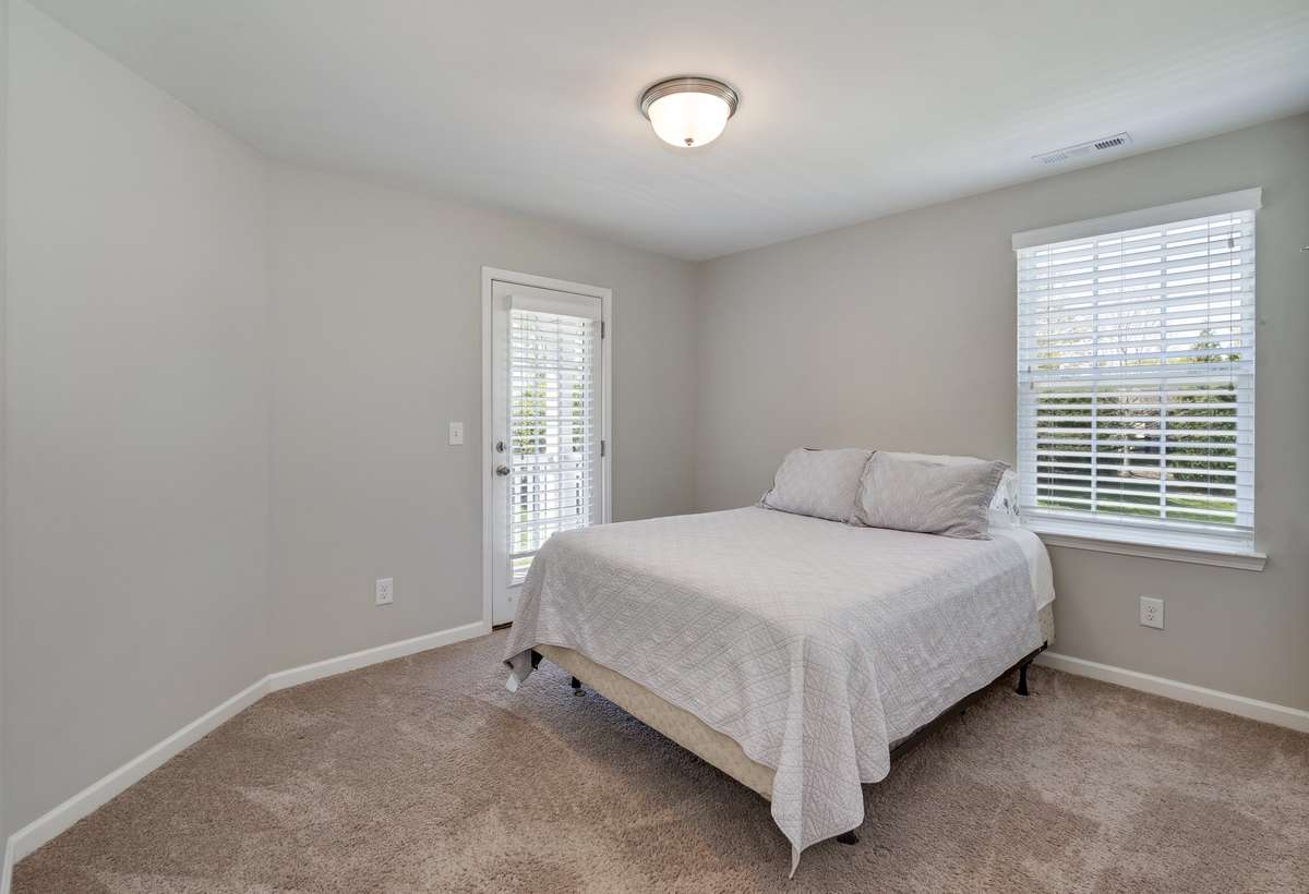 Bed 3 with access to upstairs balcony. Such a cool feature of this layout!