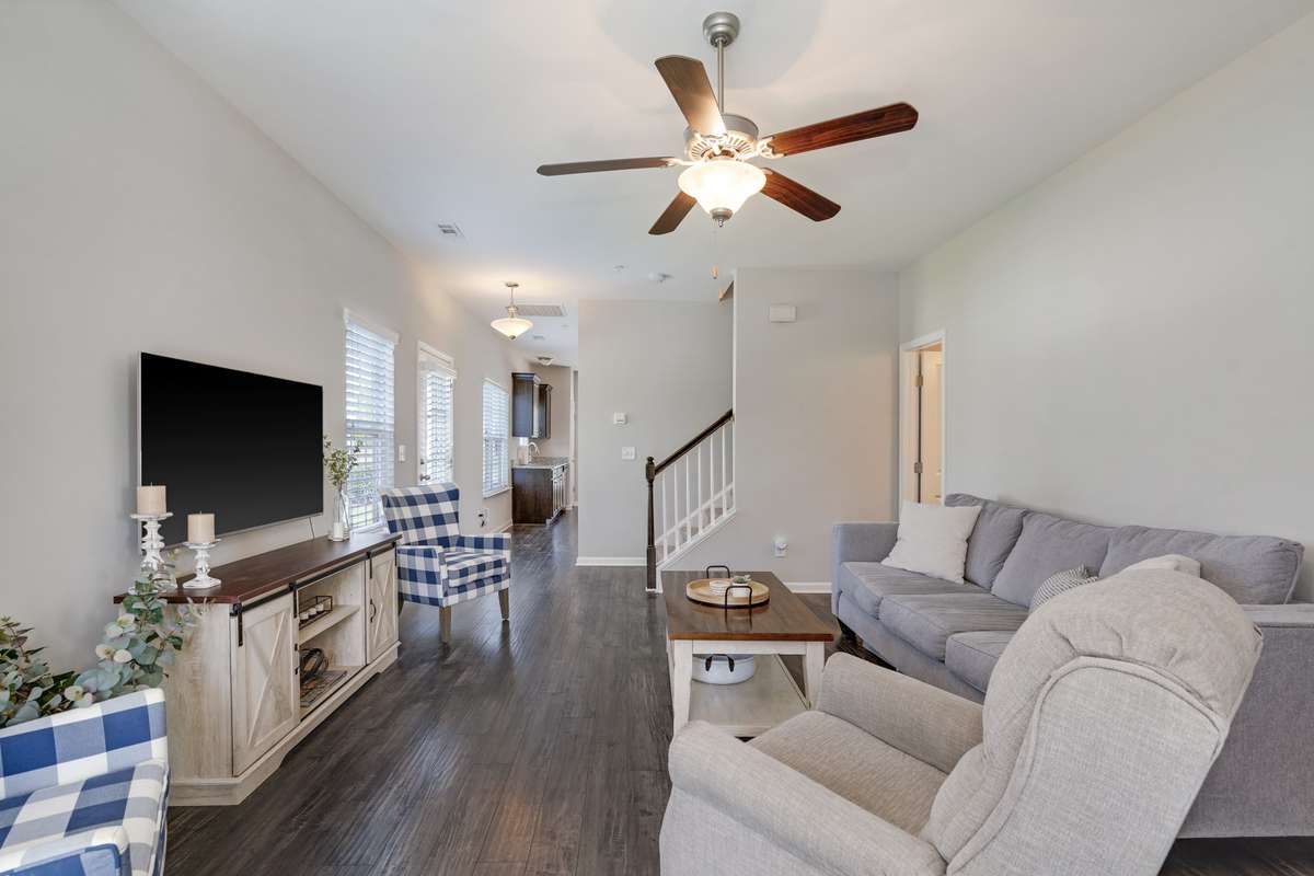 Great room is filled with natural light, creating a warm and inviting space perfect for relaxing or entertaining