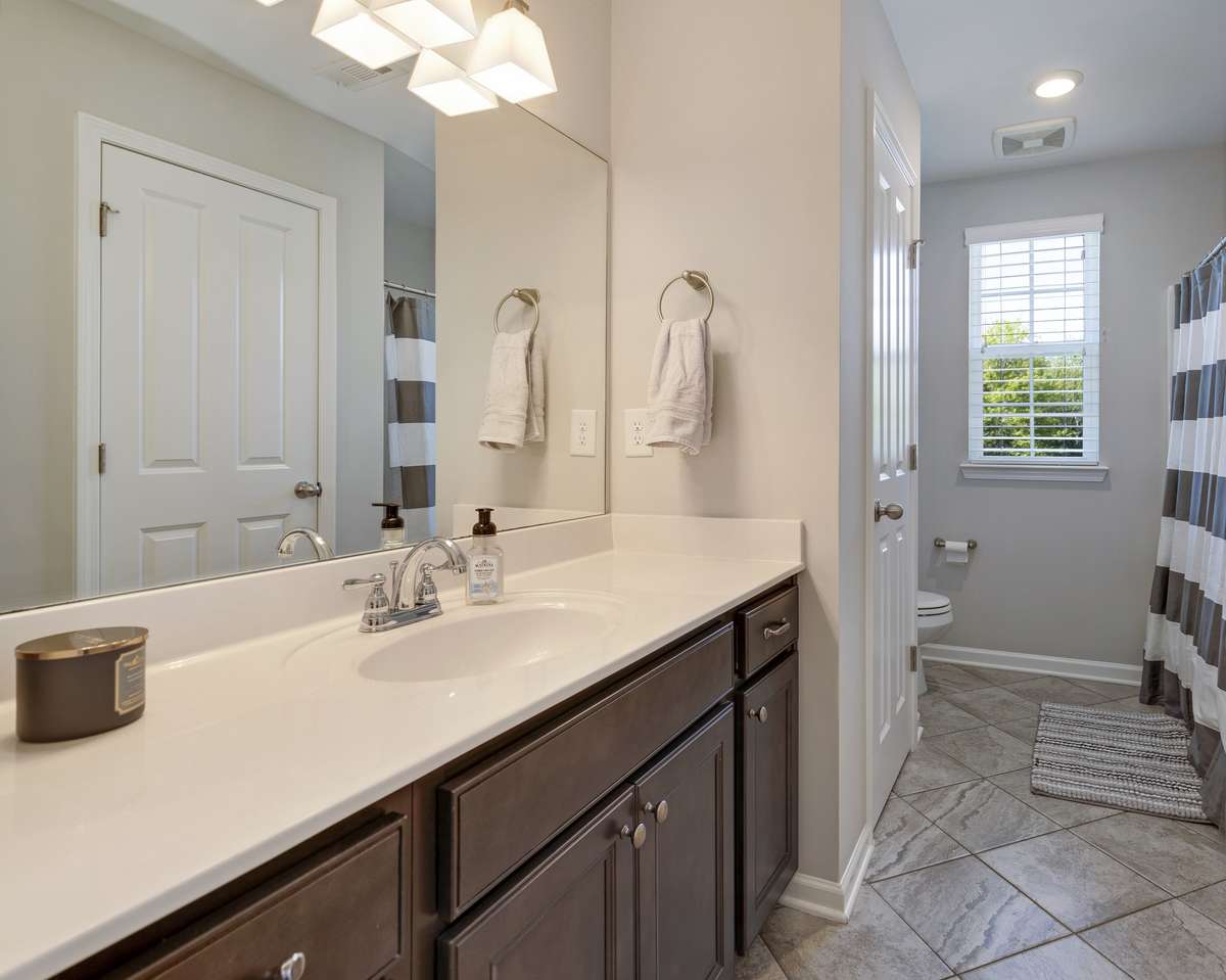 Upstairs full bath offers a generous amount of space