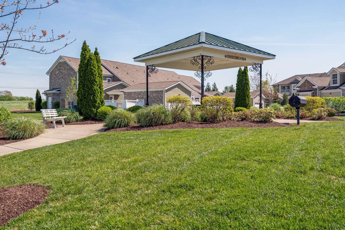 Common space is located across from this home w/ grilling area, benches, and green space!
