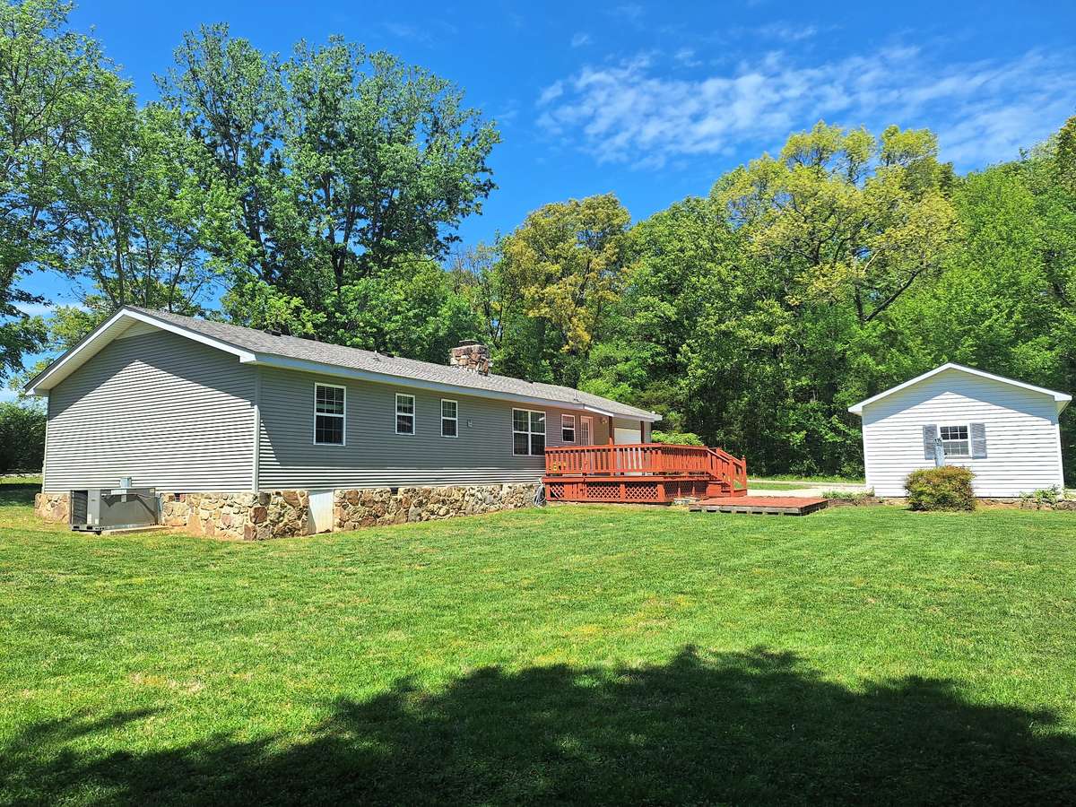 Vinyl Siding and Mountain Stone wrap this home with lots of love left to give!!