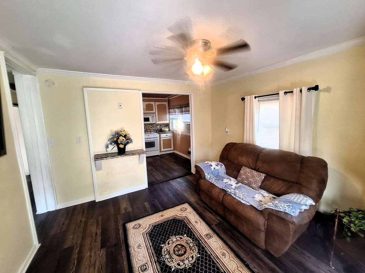 Inside you will find a cozy living room that has a gas line if you want to add your own fireplace!!