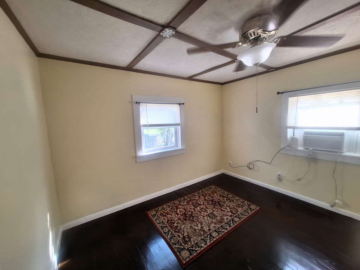 The master bedroom has coffered style ceiling and the original hardwoods floors of the house too!!