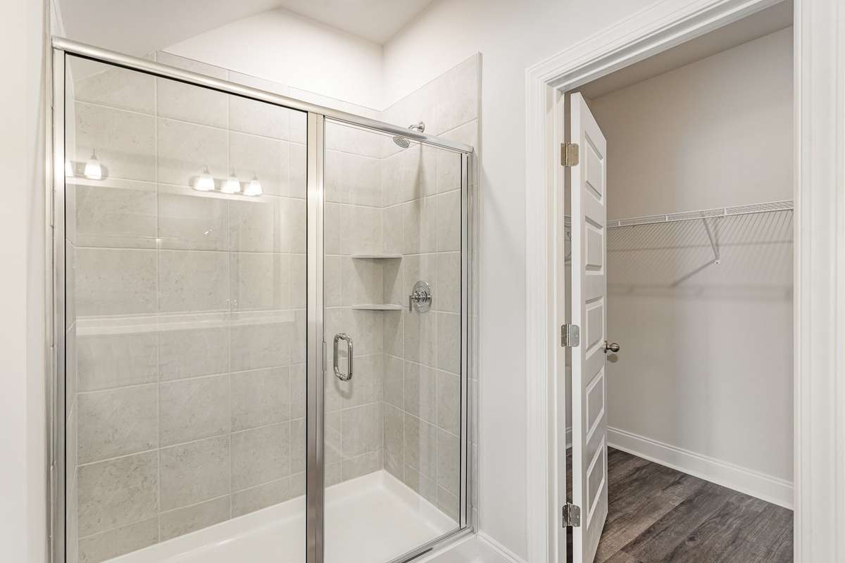Tile Shower in the Primary Bathroom *Photos not of exact home*